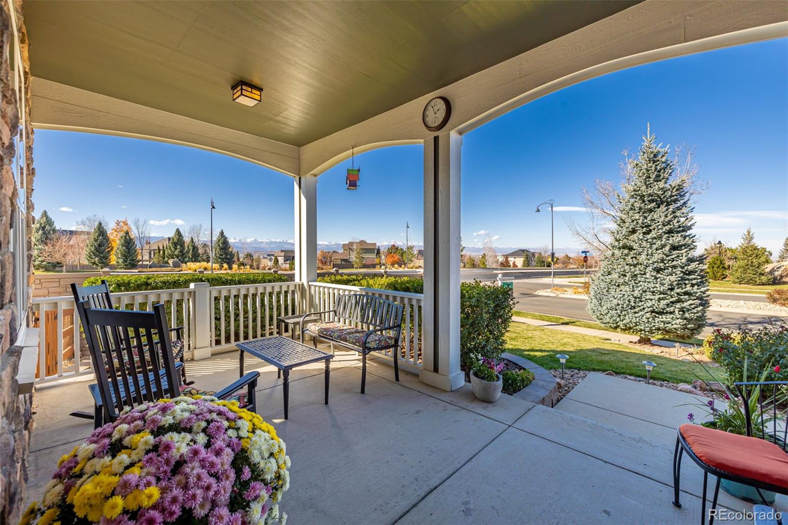 14704 Eagle River Loop Broomfield, CO 80023 - Photo 5 of 30 a balcony with chairs and umbrella