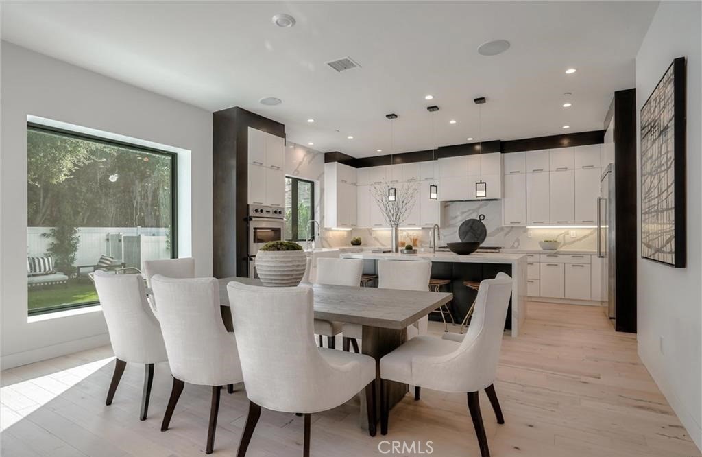 15926 Morrison Street Encino, CA 91436 - Photo 14 of 67 a view of a dining room with furniture
