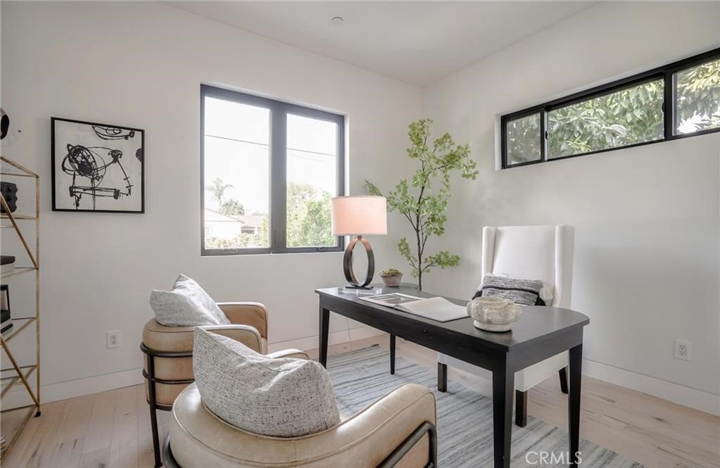 15926 Morrison Street Encino, CA 91436 - Photo 23 of 67 a living room with furniture and a window