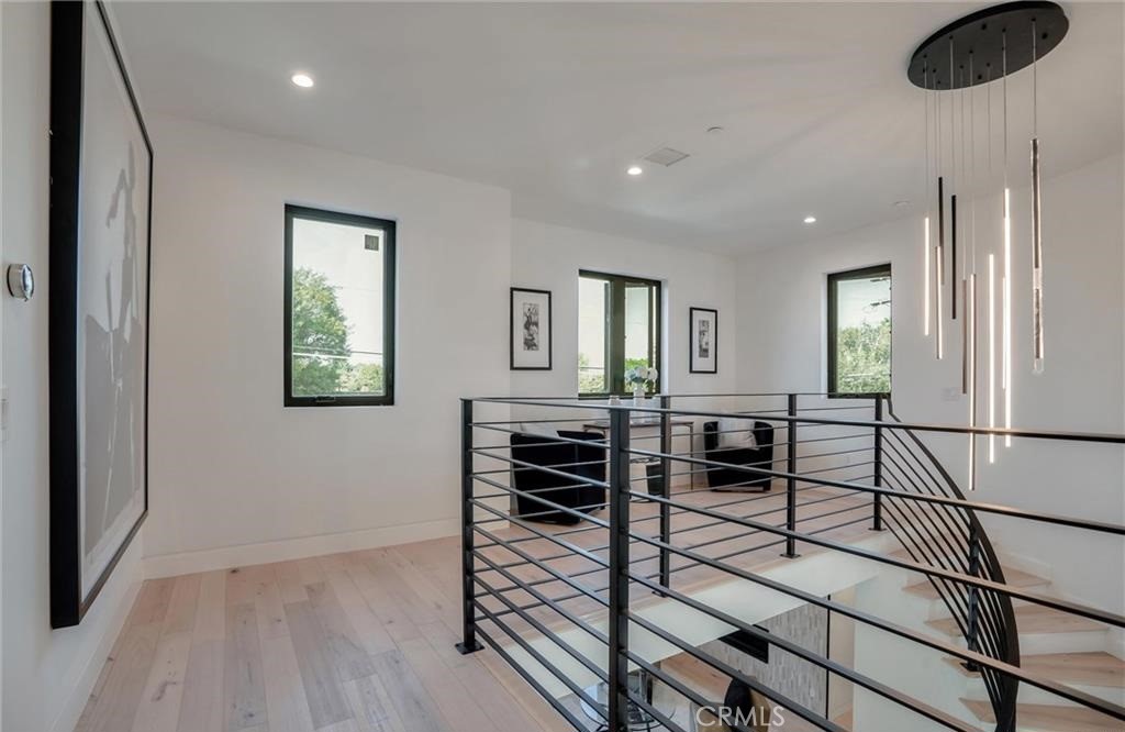 15926 Morrison Street Encino, CA 91436 - Photo 29 of 67 a view of a livingroom with furniture and wooden floor