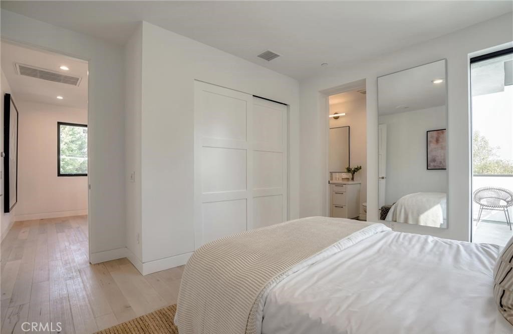 15926 Morrison Street Encino, CA 91436 - Photo 33 of 67 a bedroom with a bed and a potted plant