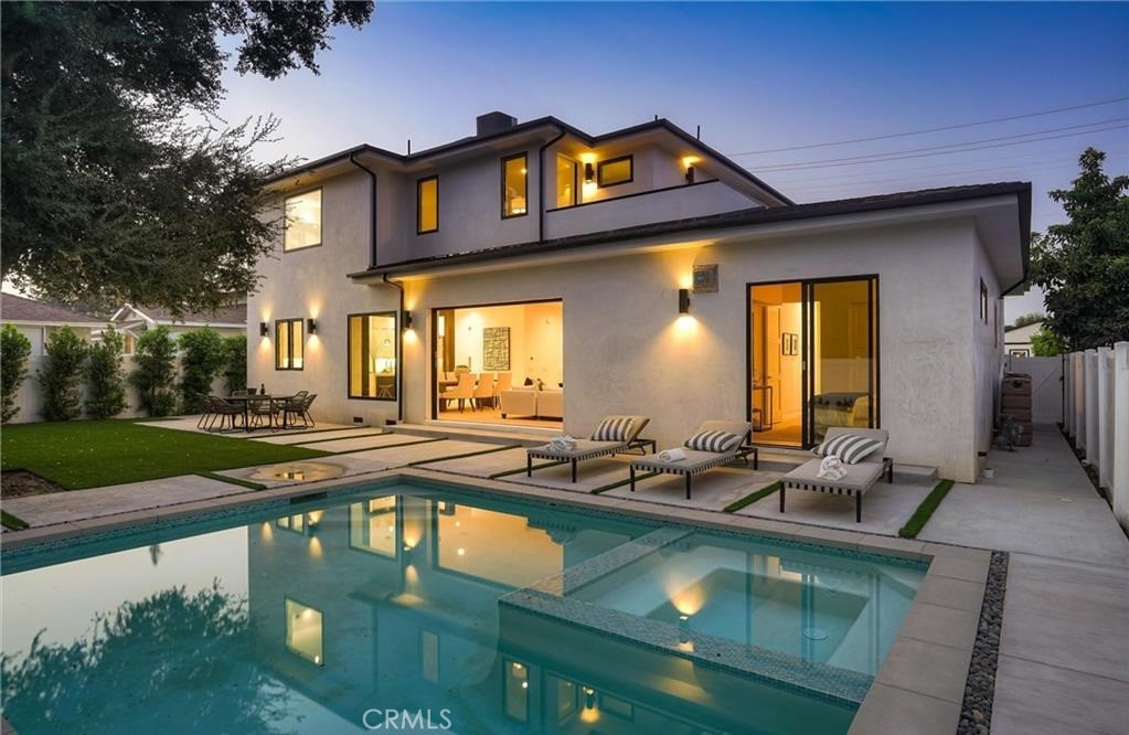 15926 Morrison Street Encino, CA 91436 - Photo 45 of 67 a view of a house with swimming pool and sitting area
