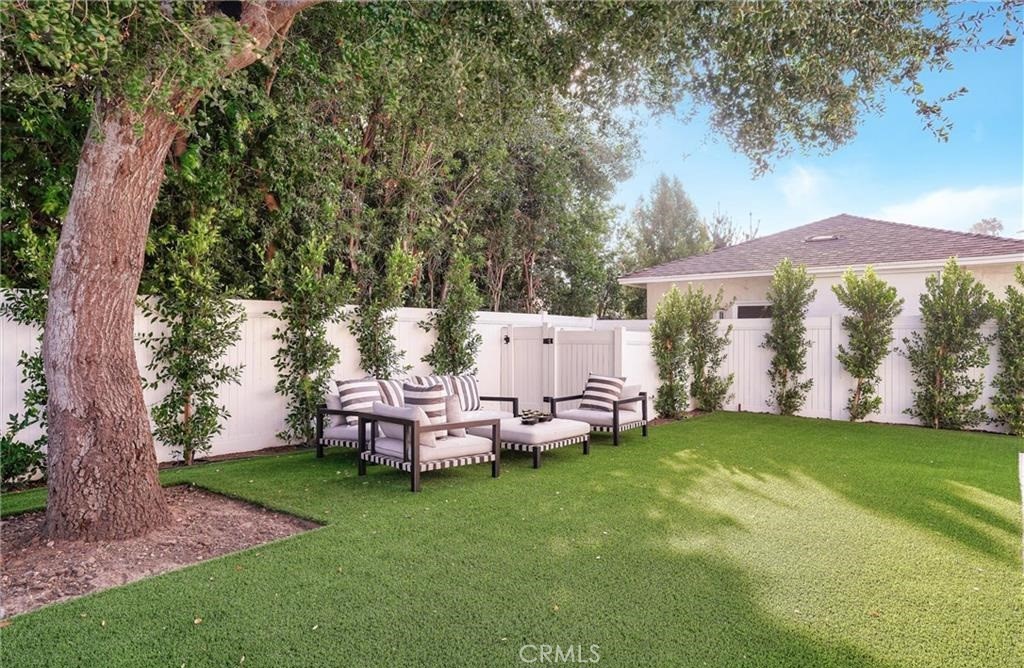 15926 Morrison Street Encino, CA 91436 - Photo 52 of 67 a view of a house with backyard and sitting area