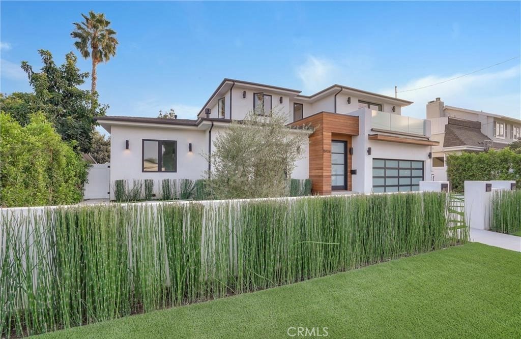 15926 Morrison Street Encino, CA 91436 - Photo 58 of 67 a view of a large building with a big yard and plants