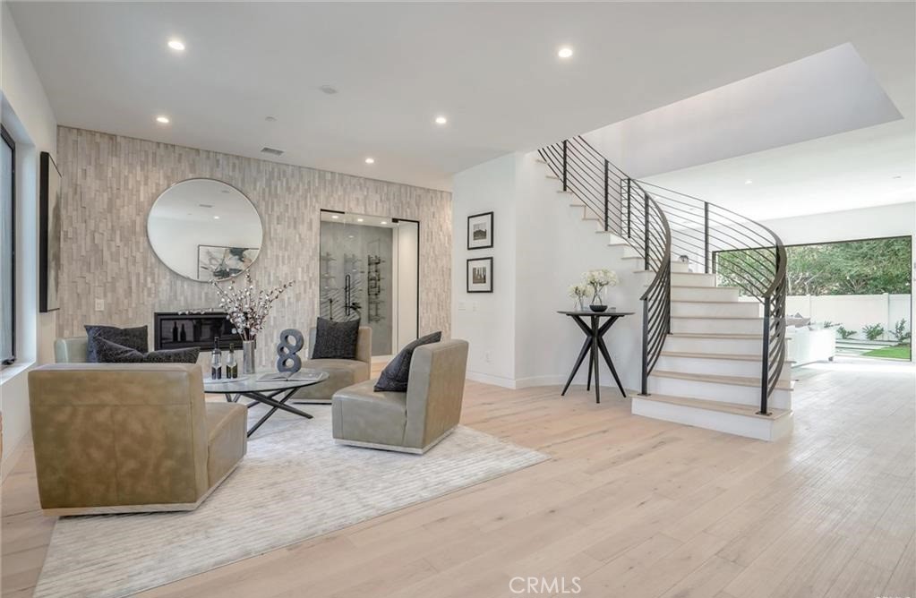 15926 Morrison Street Encino, CA 91436 - Photo 6 of 67 a living room with furniture and white walls