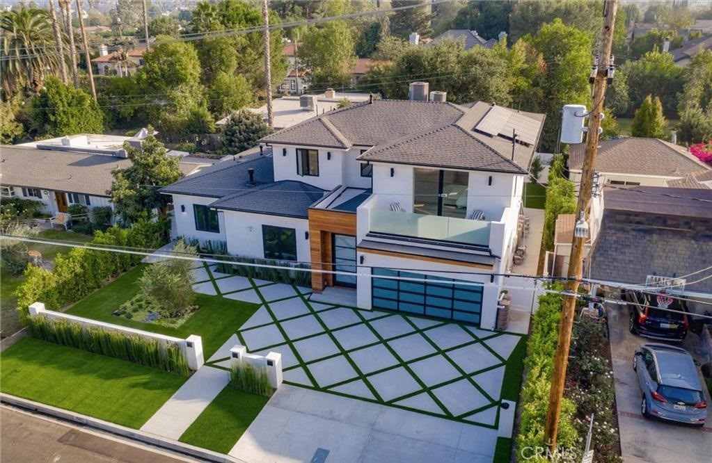15926 Morrison Street Encino, CA 91436 - Photo 61 of 67 an aerial view of a house with swimming pool and glass windows