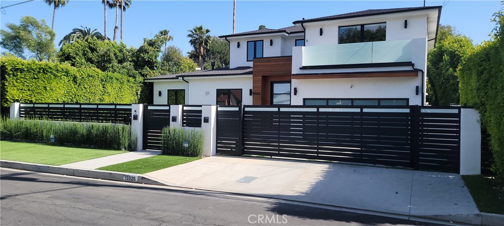 15926 Morrison Street Encino, CA 91436 - Photo 65 of 67 a front view of a house with a yard