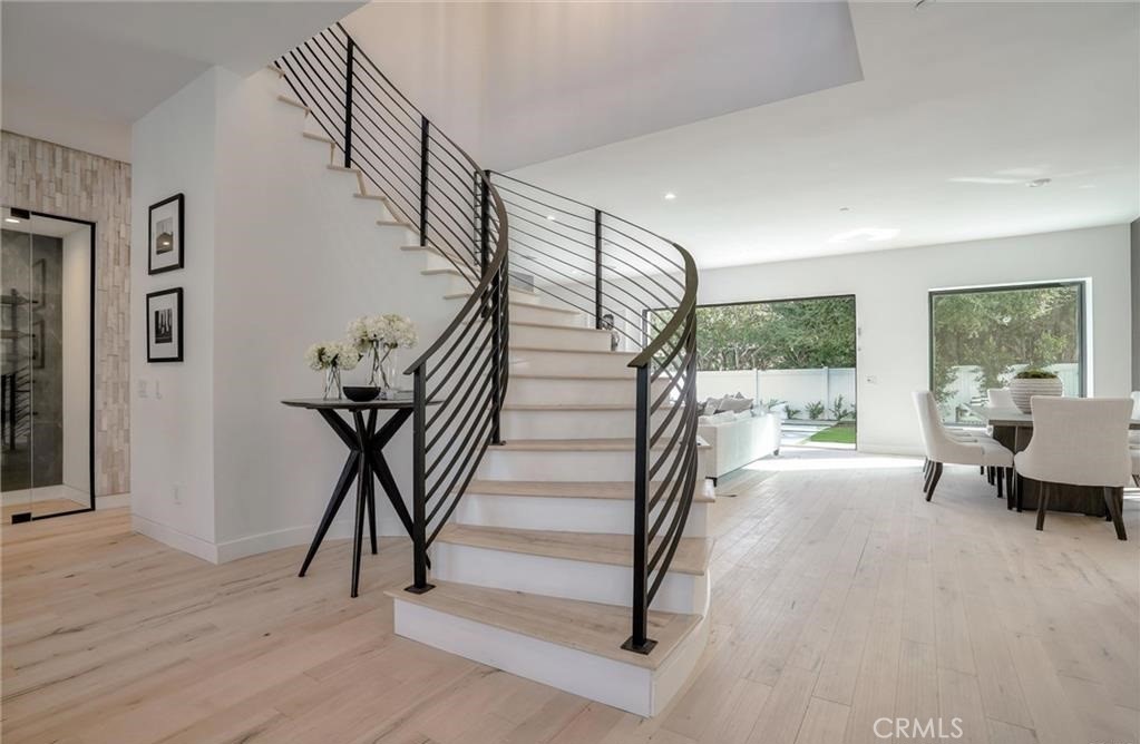 15926 Morrison Street Encino, CA 91436 - Photo 7 of 67 a view of entryway and hall with wooden floor