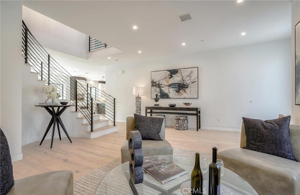 15926 Morrison Street Encino, CA 91436 - Photo 9 of 67 a living room with furniture and white walls