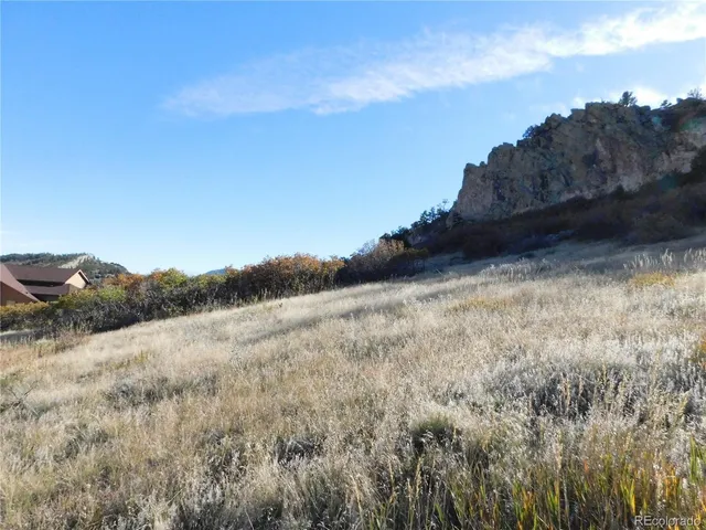 a view of a ocean with a building in the background