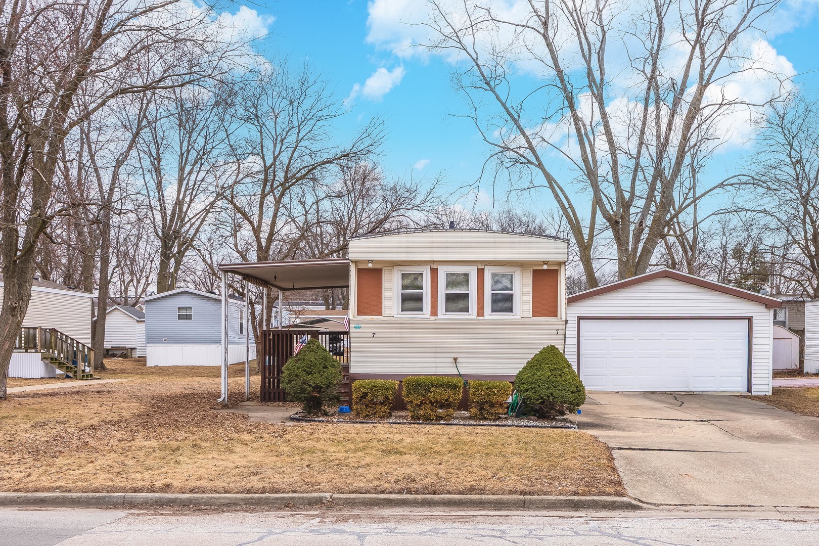 7 Oak Valley Road Bloomington, IL 61704 - Photo 26 of 27 a front view of a house with a yard