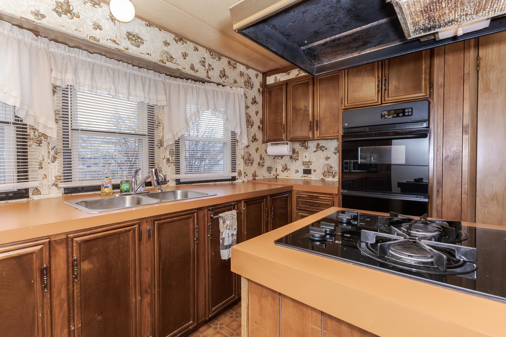 7 Oak Valley Road Bloomington, IL 61704 - Photo 7 of 27 a kitchen with a sink stove top oven and cabinets
