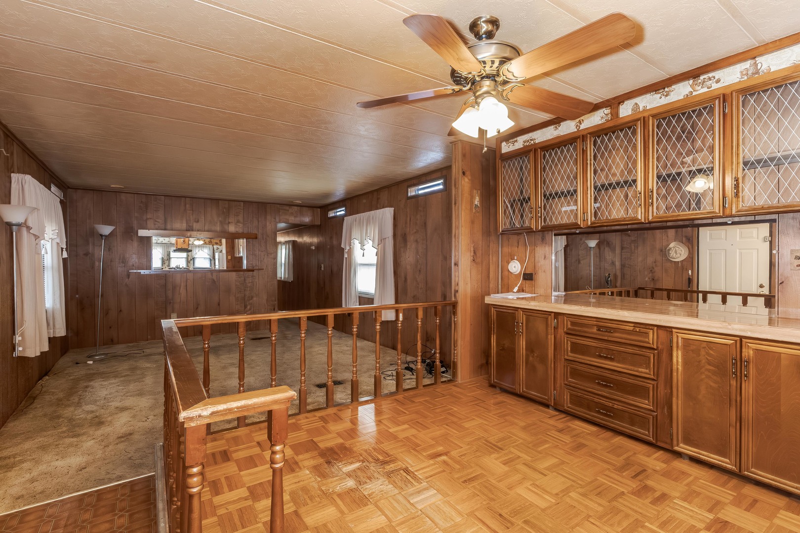 7 Oak Valley Road Bloomington, IL 61704 - Photo 8 of 27 a room with chandelier fan and windows