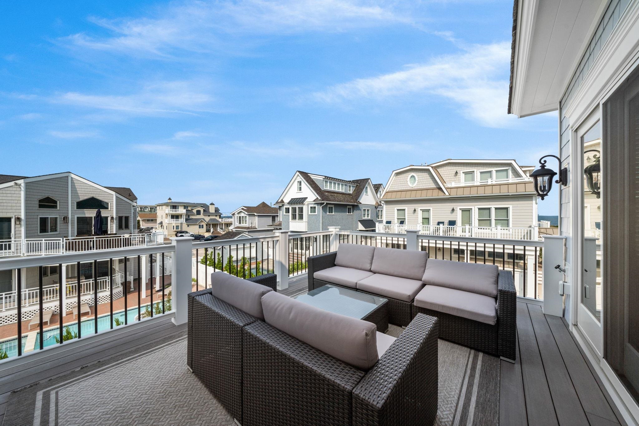 75 24th Street East Avalon, NJ 08202 - Photo 22 of 47 a view of a balcony with a couch
