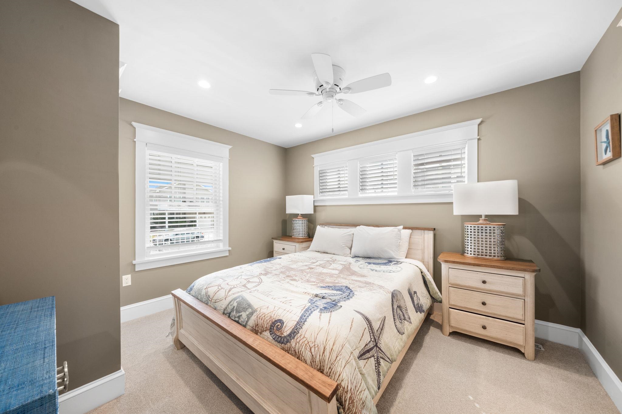 75 24th Street East Avalon, NJ 08202 - Photo 23 of 47 a bedroom with a bed and a chandelier