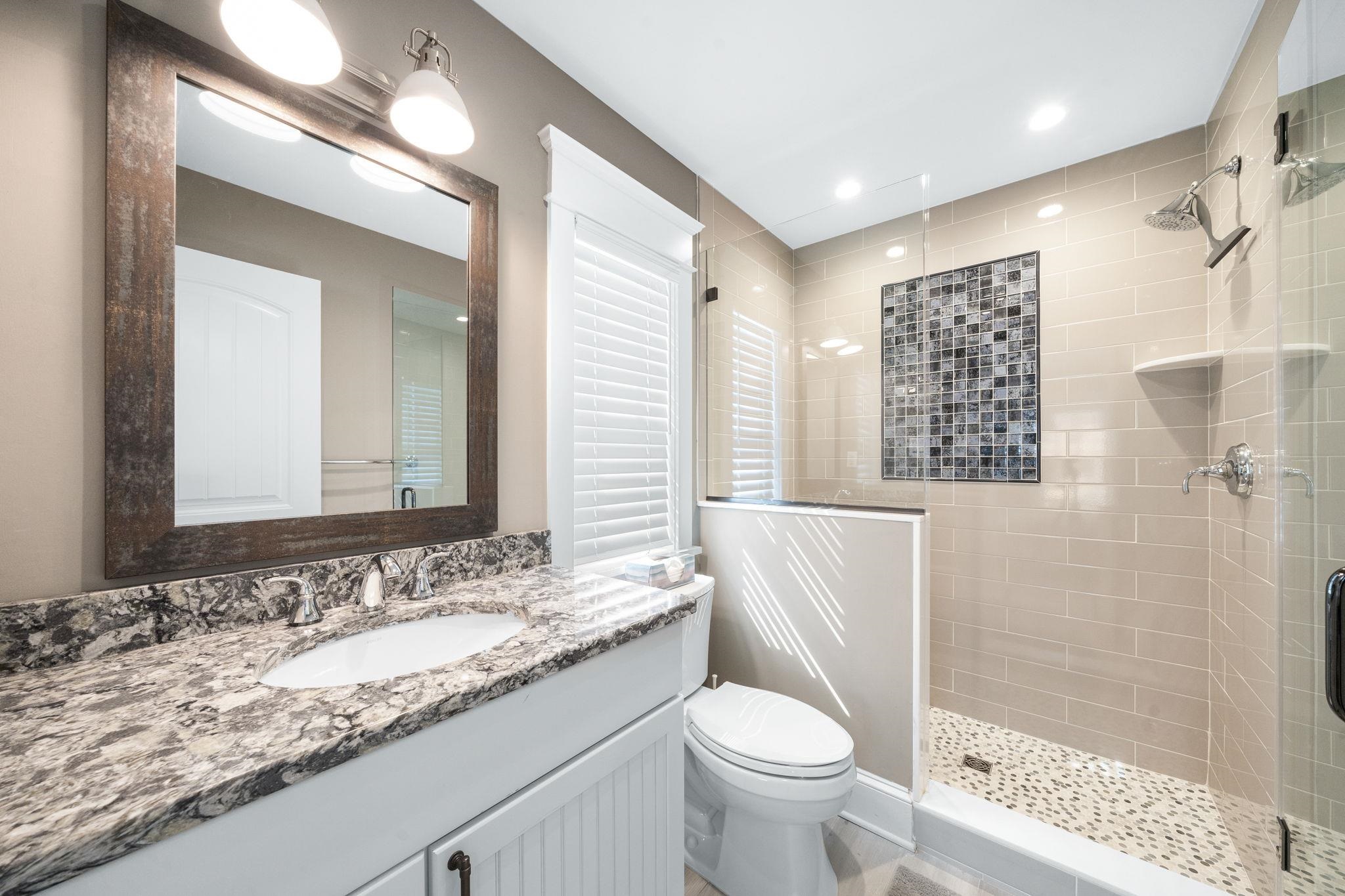 75 24th Street East Avalon, NJ 08202 - Photo 24 of 47 a bathroom with a granite countertop sink toilet and shower