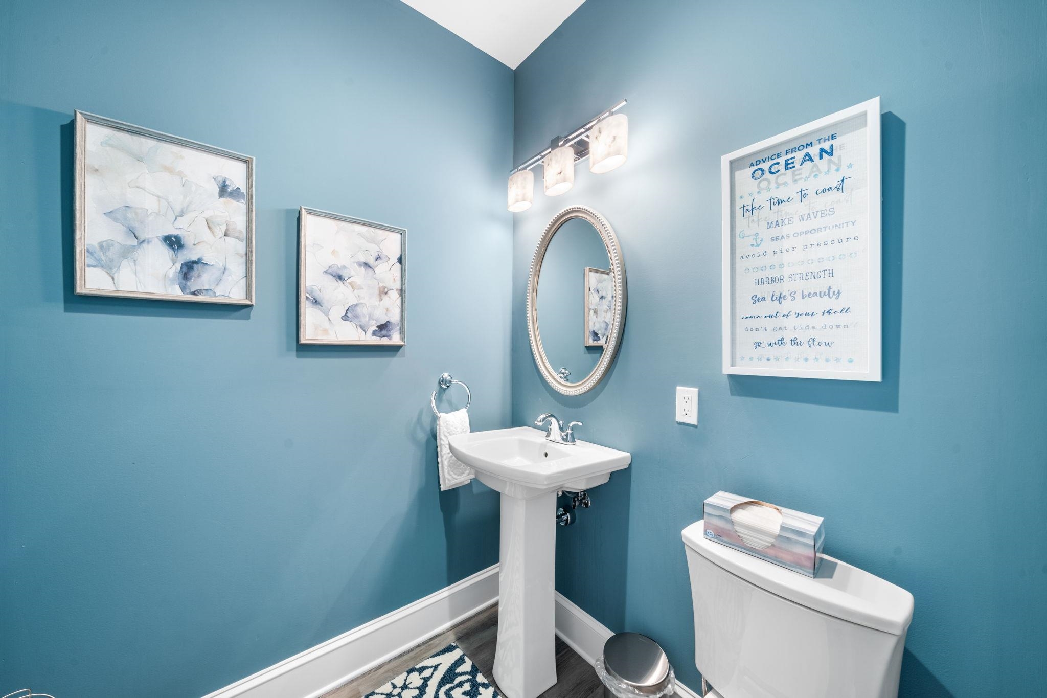 75 24th Street East Avalon, NJ 08202 - Photo 29 of 47 a bathroom with a toilet a sink and a mirror