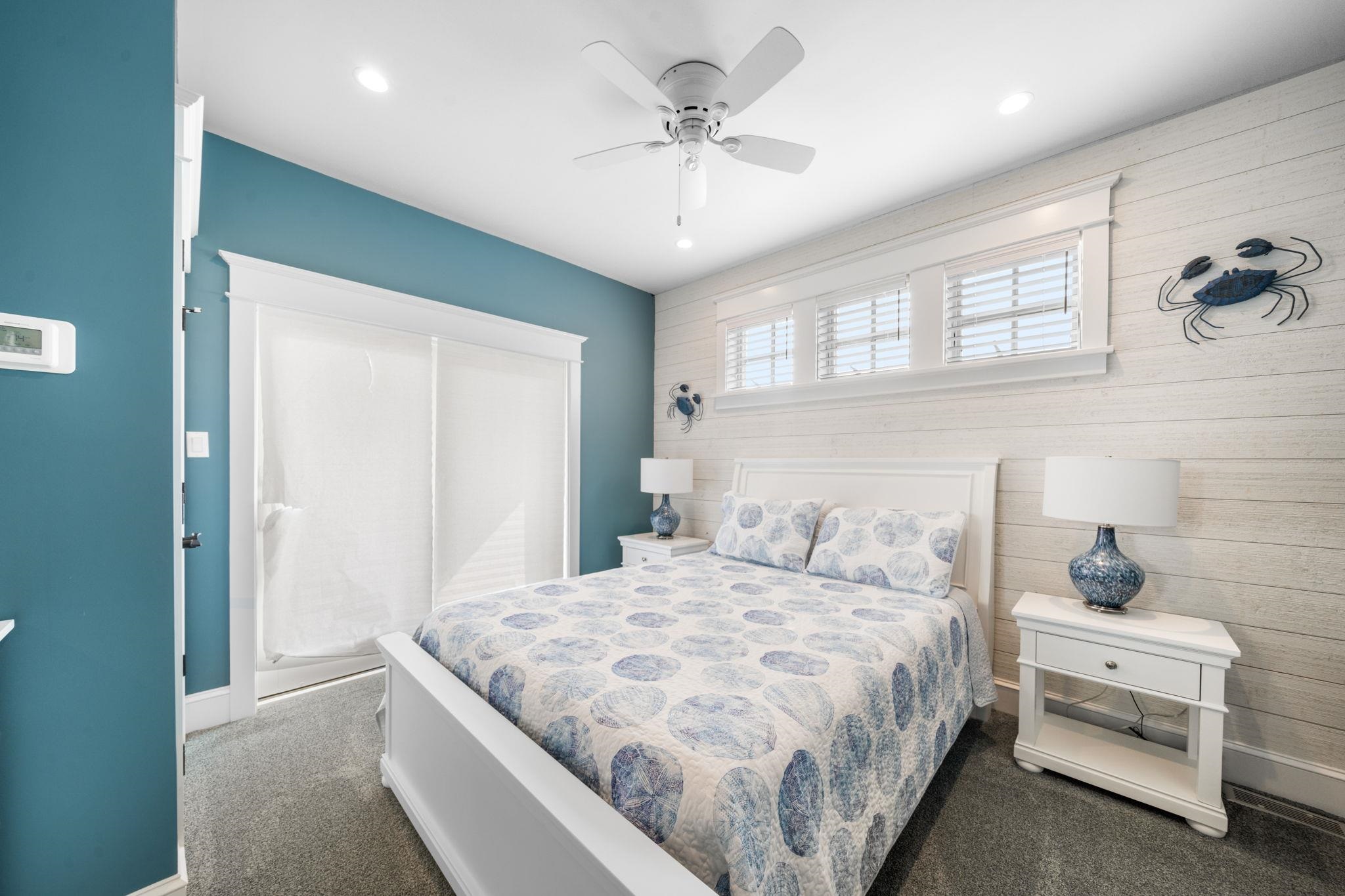 75 24th Street East Avalon, NJ 08202 - Photo 30 of 47 a bedroom with a bed and a chandelier