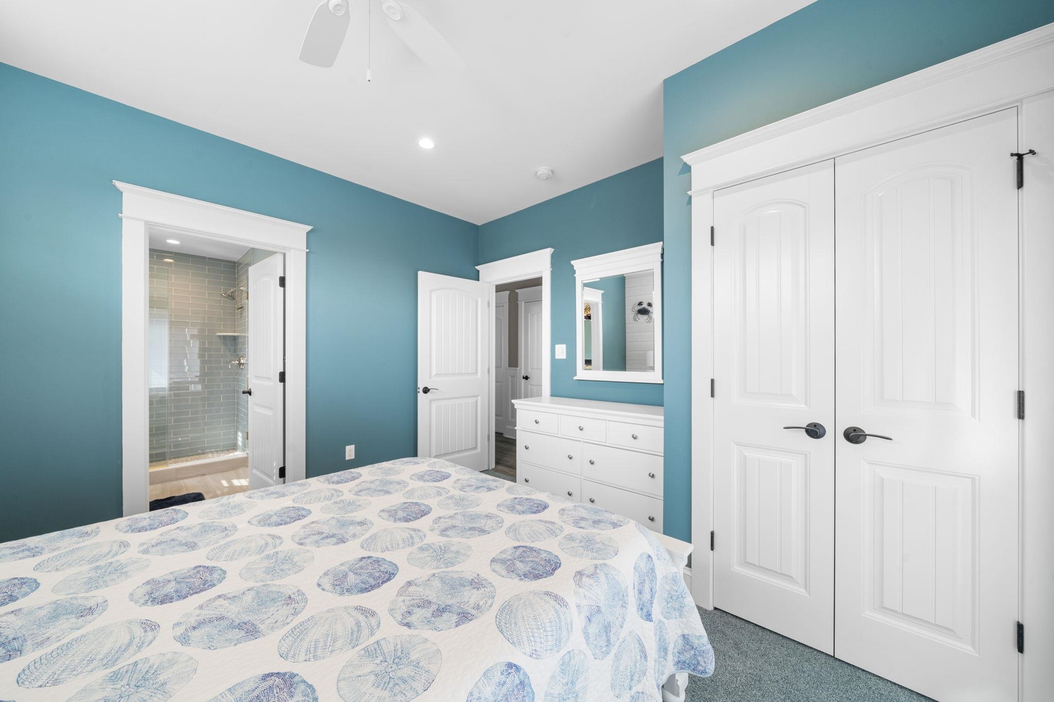 75 24th Street East Avalon, NJ 08202 - Photo 31 of 47 a bedroom with a bed and a mirror