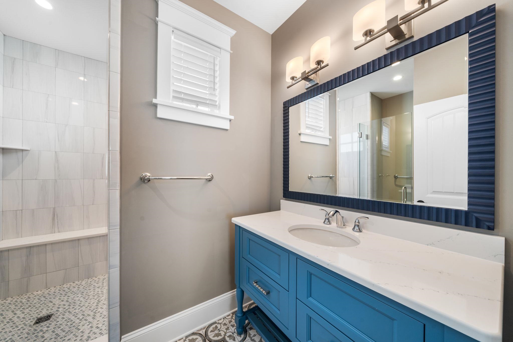 75 24th Street East Avalon, NJ 08202 - Photo 36 of 47 a bathroom with a sink a vanity and a mirror