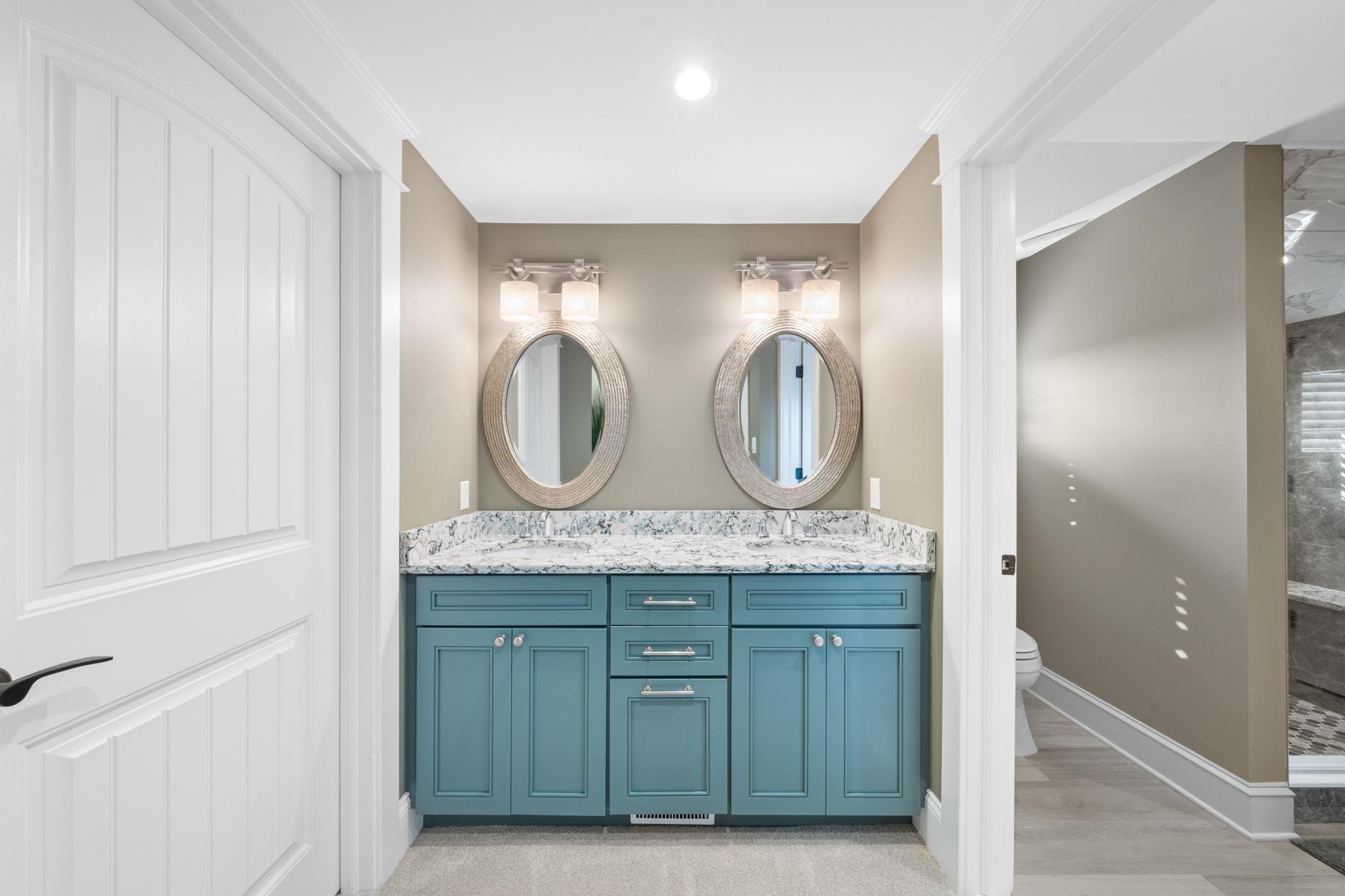 75 24th Street East Avalon, NJ 08202 - Photo 38 of 47 a bathroom with double vanity and two mirrors