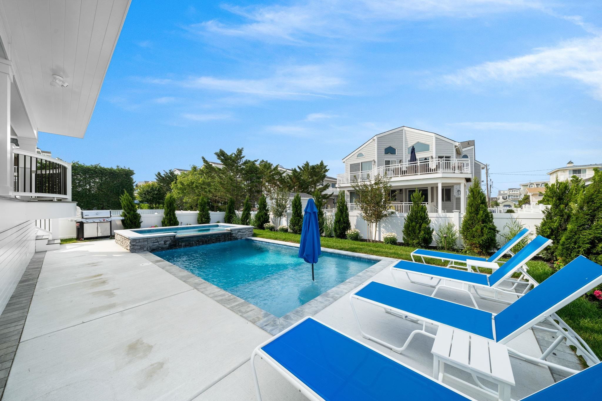 75 24th Street East Avalon, NJ 08202 - Photo 4 of 47 a view of a house with swimming pool