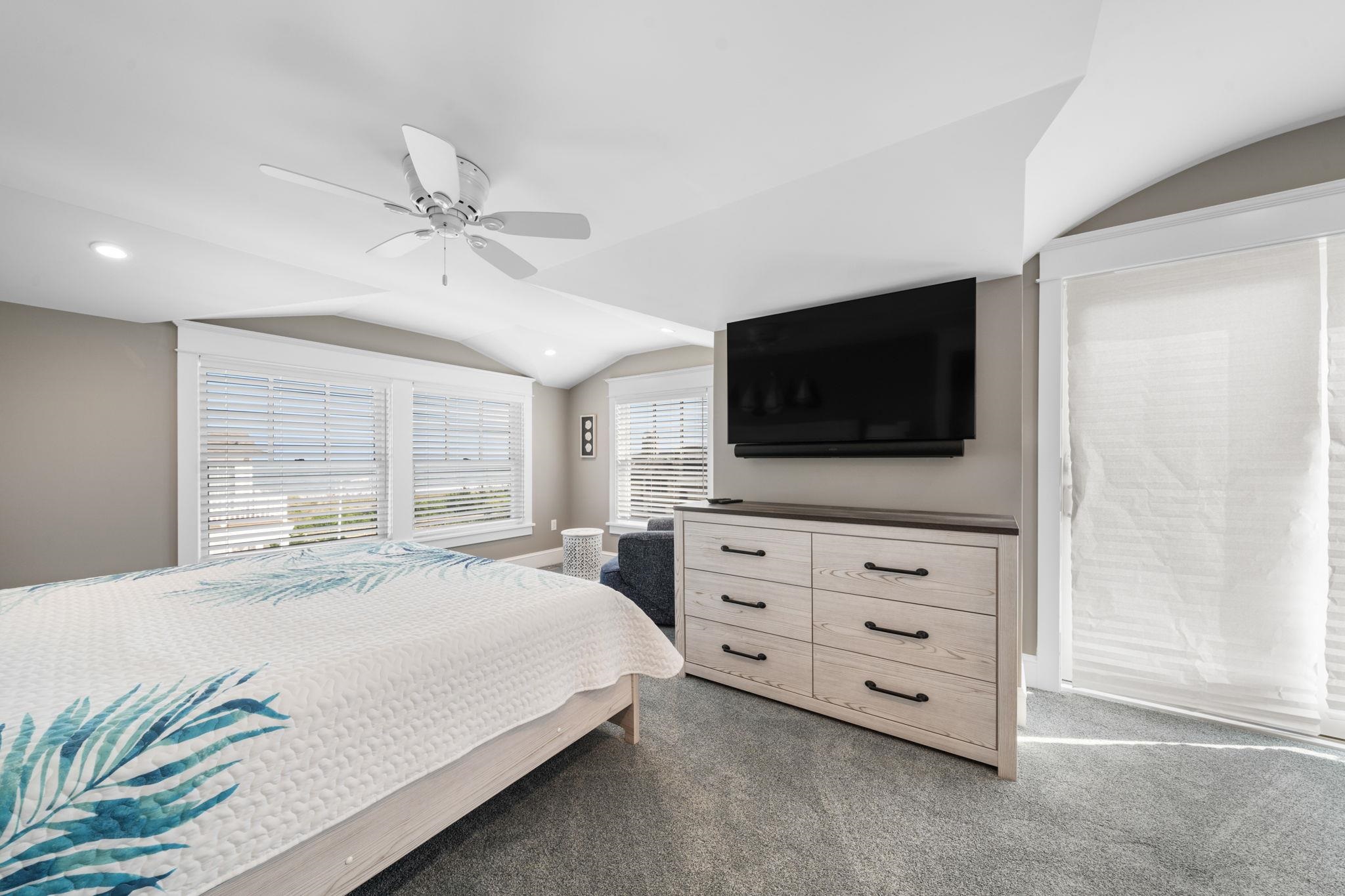 75 24th Street East Avalon, NJ 08202 - Photo 44 of 47 a bedroom with a bed a flat screen tv and a dresser