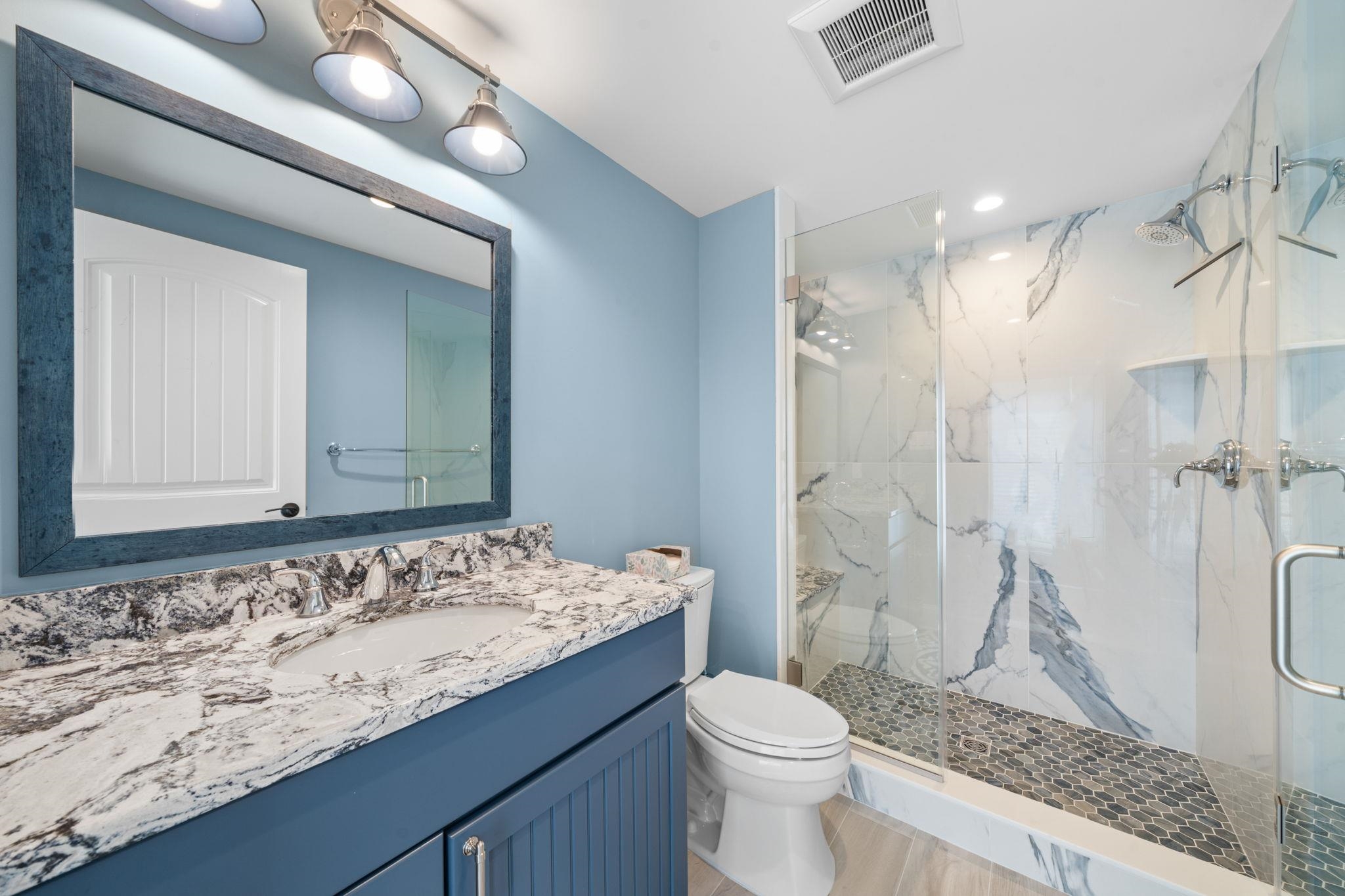75 24th Street East Avalon, NJ 08202 - Photo 46 of 47 a bathroom with a granite countertop sink toilet and shower