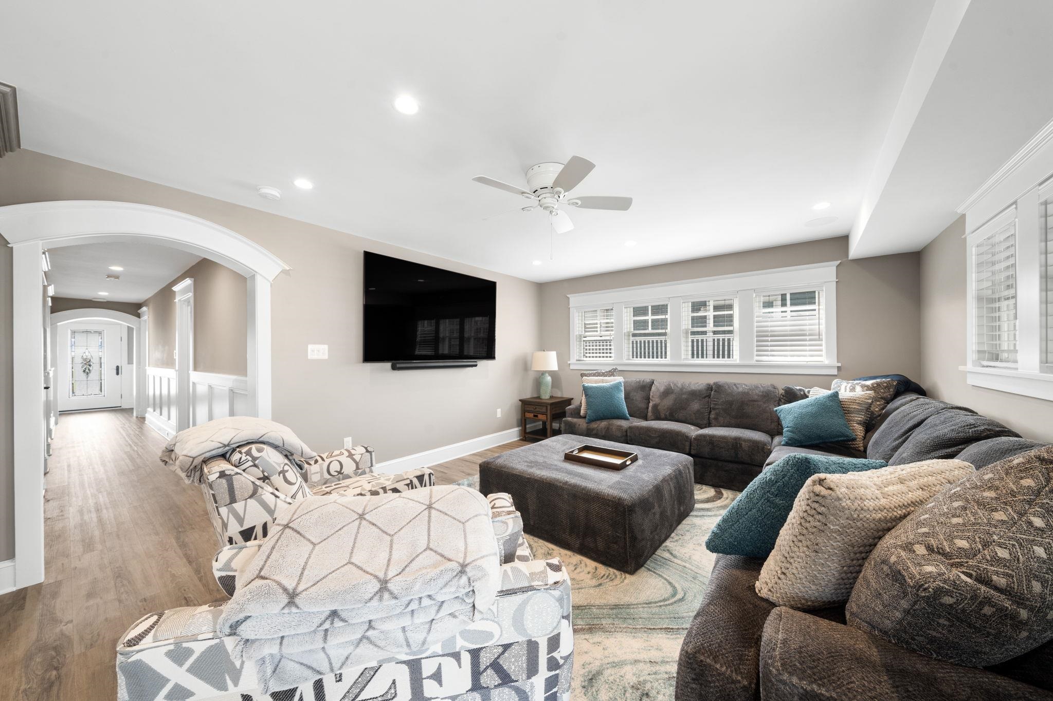 75 24th Street East Avalon, NJ 08202 - Photo 7 of 47 a living room with furniture ceiling fan and a flat screen tv