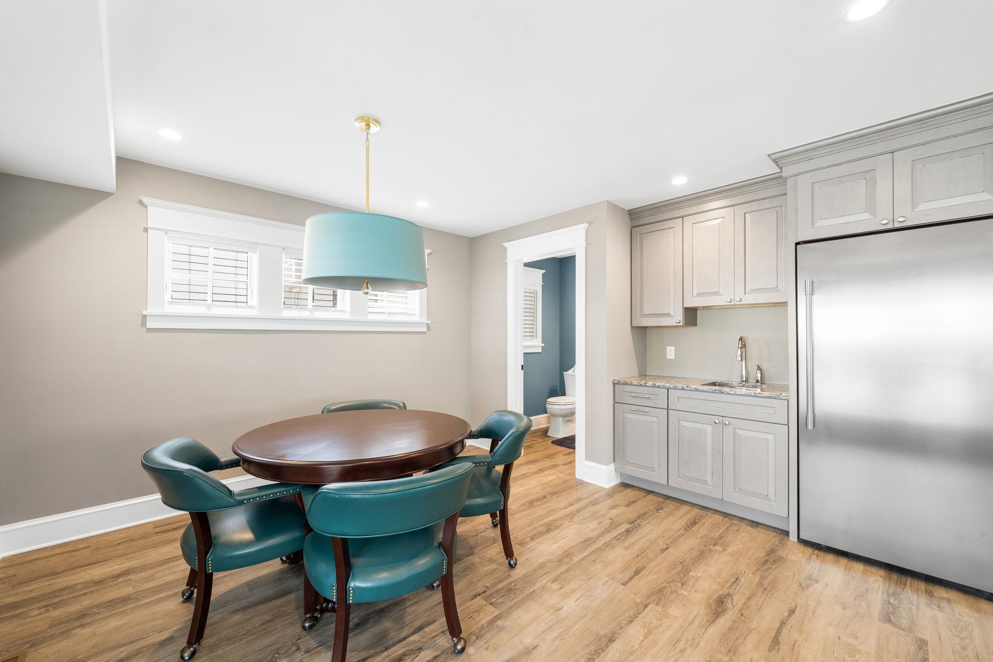 75 24th Street East Avalon, NJ 08202 - Photo 8 of 47 a kitchen with stainless steel appliances granite countertop a dining table chairs and a refrigerator