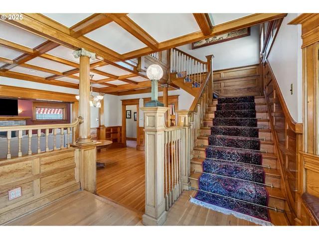 a view of a living room and entryway