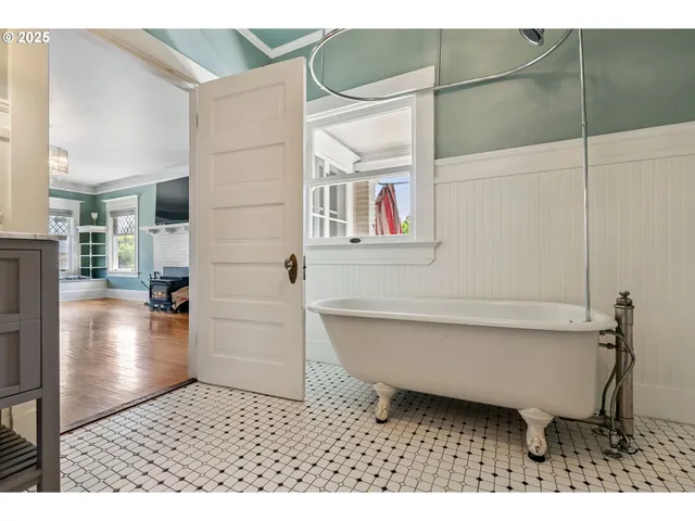 a bathroom with a bathtub and a shower