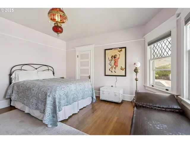 a spacious bedroom with a bed and window