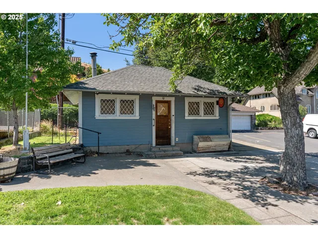 a house view with a backyard space