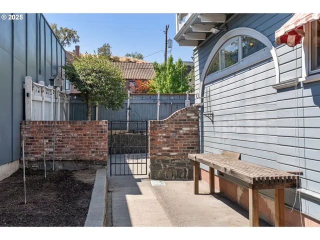 a view of a house with a garden and pathway