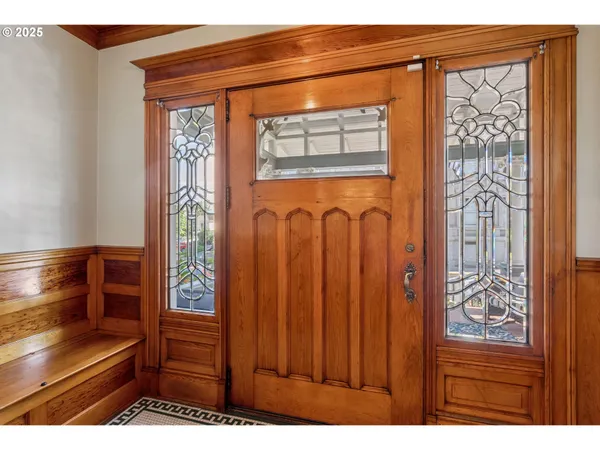 a view of front door with a mirror