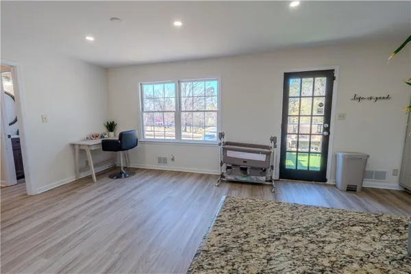 a living room with furniture and a window