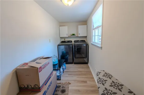 a kitchen with storage and utility