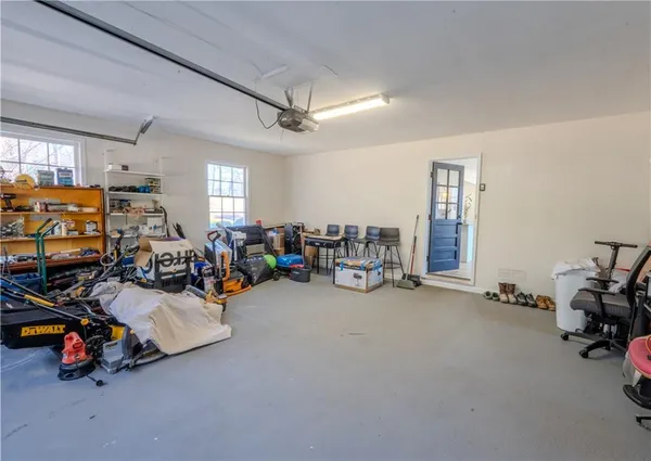 a view of a garage with a bike and a car