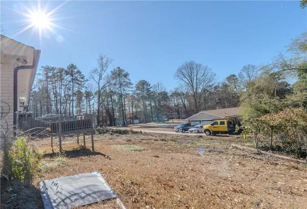 a view of a park with large trees