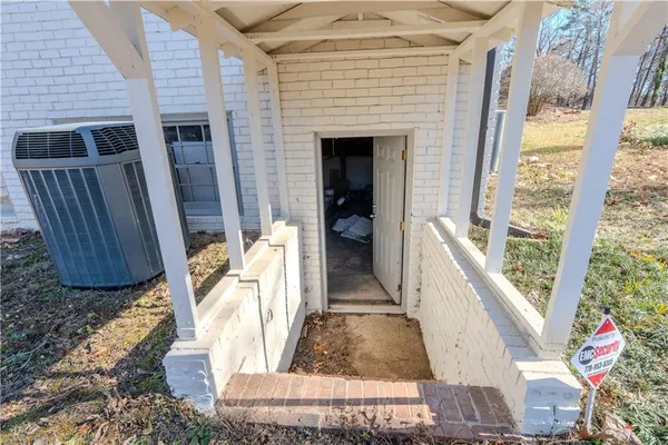 a view of living room with furniture and a fireplace