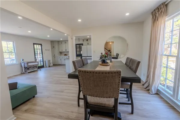 a view of a dining room with furniture and wooden floor