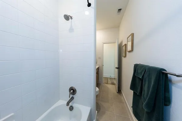 a bathroom with a tub and a shower
