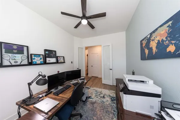 a workspace with furniture and window