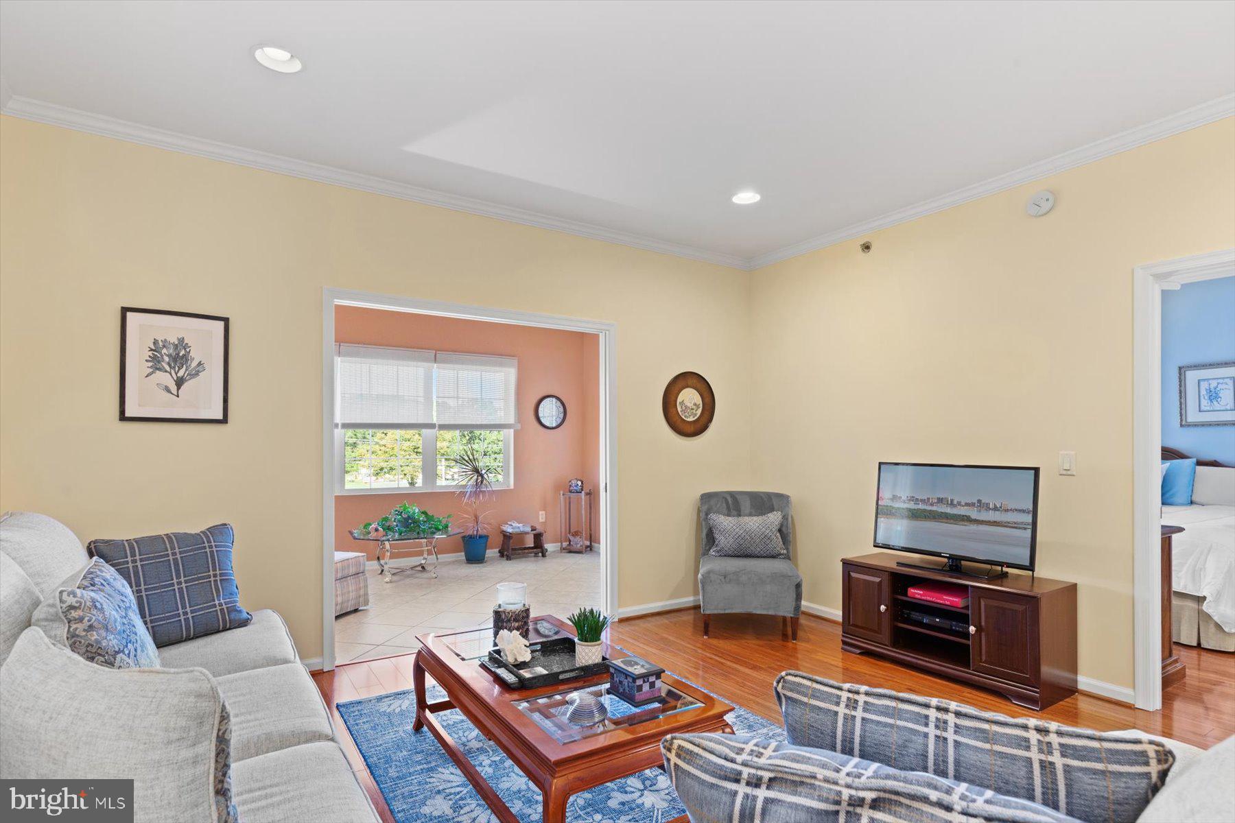 30413 Cedar Neck Road, Unit 309 Ocean View, DE 19970 - Photo 14 of 53 Living Room with Sunroom