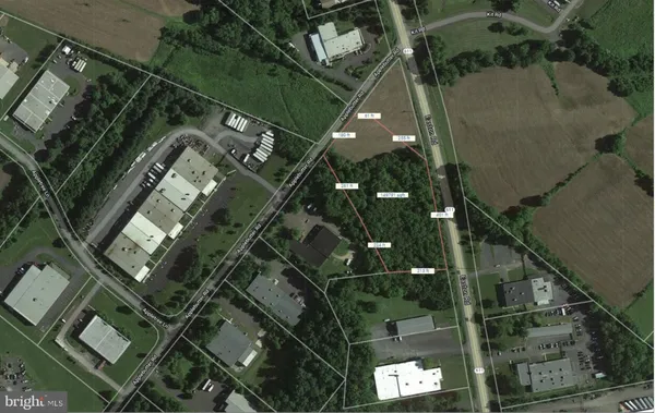 an aerial view of a residential apartment building with a yard