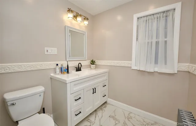 a bathroom with a sink and a toilet