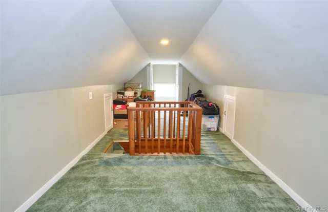 a bedroom with furniture and a wooden floor
