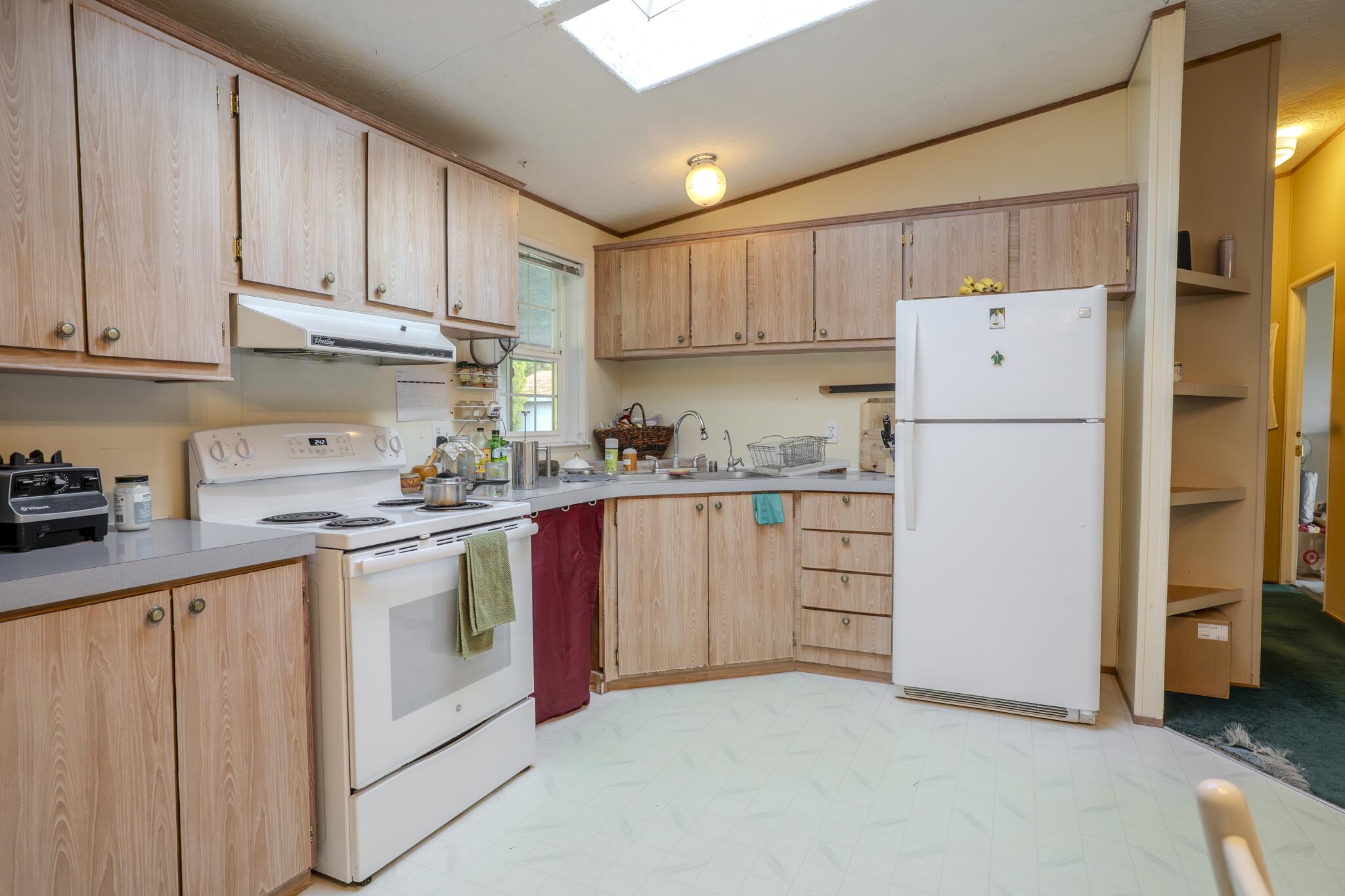 362 Humbug Creek Road Jacksonville, OR 97530 - Photo 11 of 49 a kitchen with cabinets stainless steel appliances and a counter space