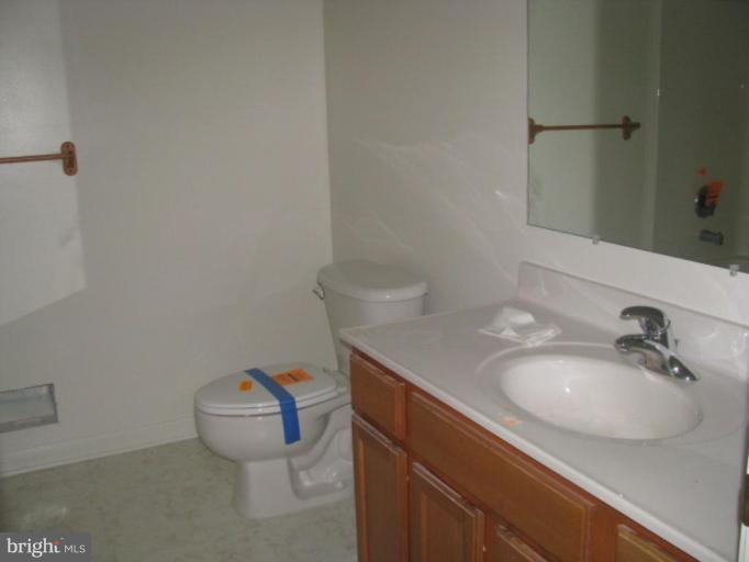 123 Martin Road Front Royal, VA 22630 - Photo 7 of 13 a bathroom with a sink toilet and vanity